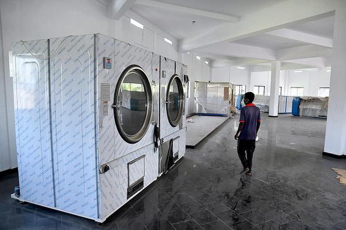 Industrial dryers in a laundry facility