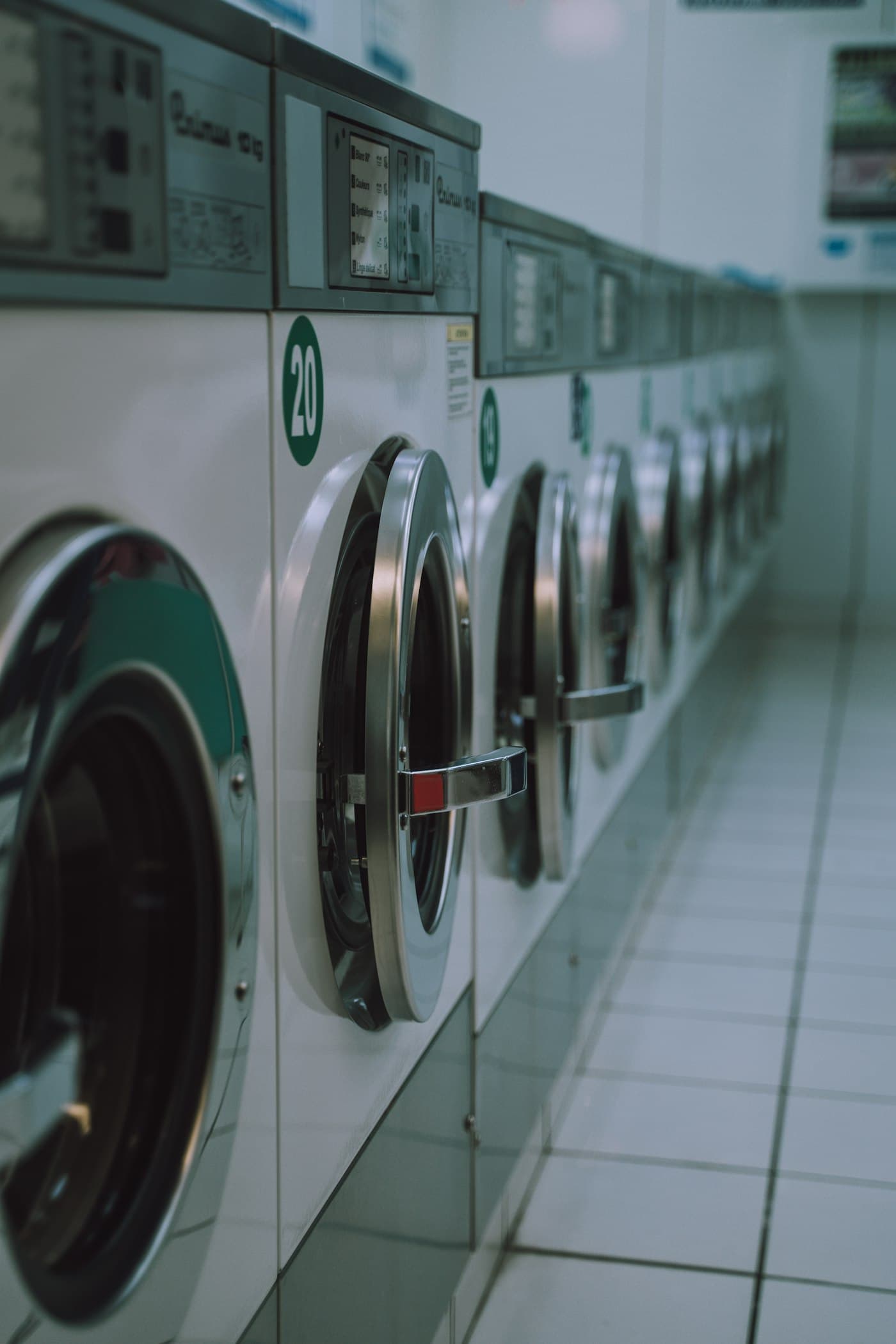 A row of modern front-load washing machines