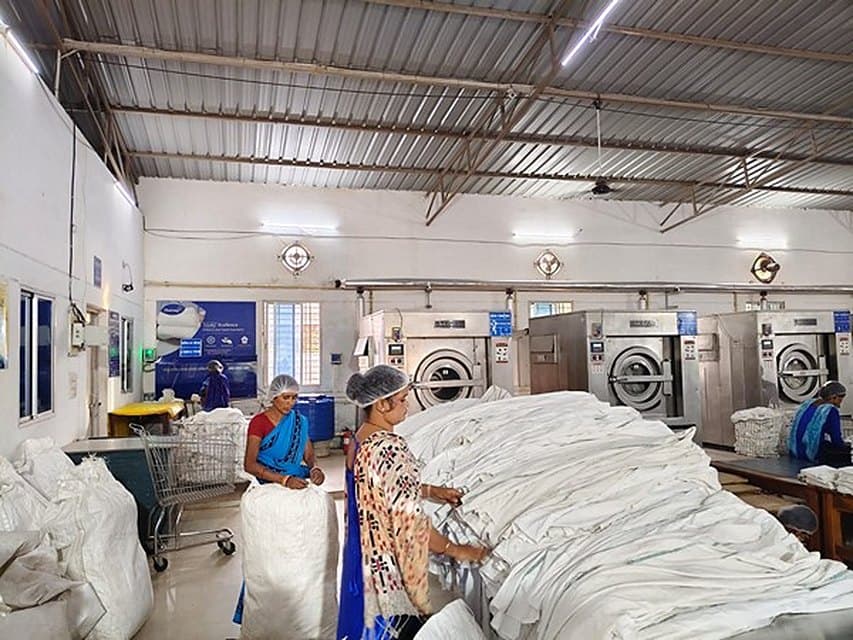 Staff sorting fresh white linen